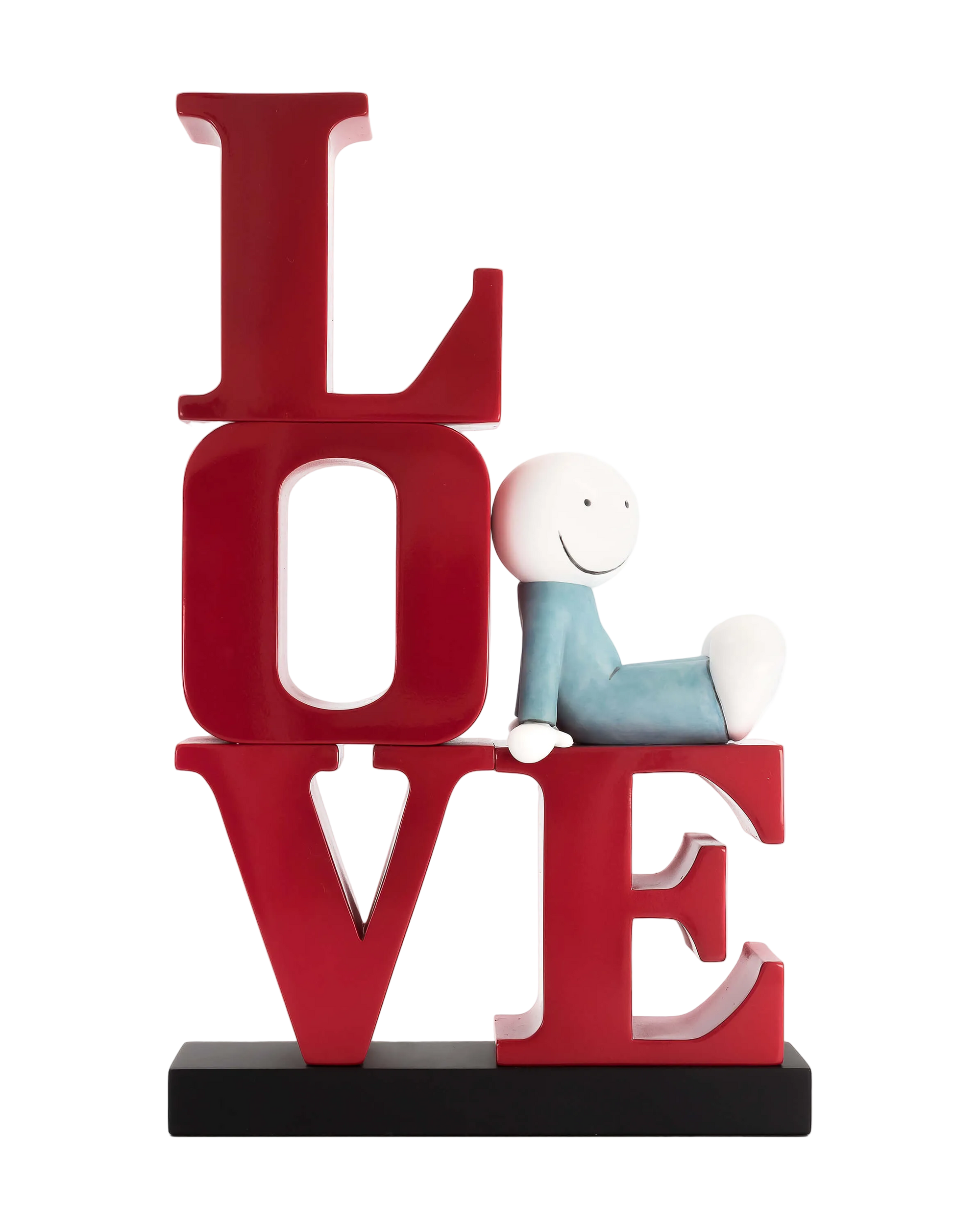 A sculpture featuring the word 'LOVE' in bold red lettering with a smiling character sitting on the letter 'E' appearing to be enjoying a book.